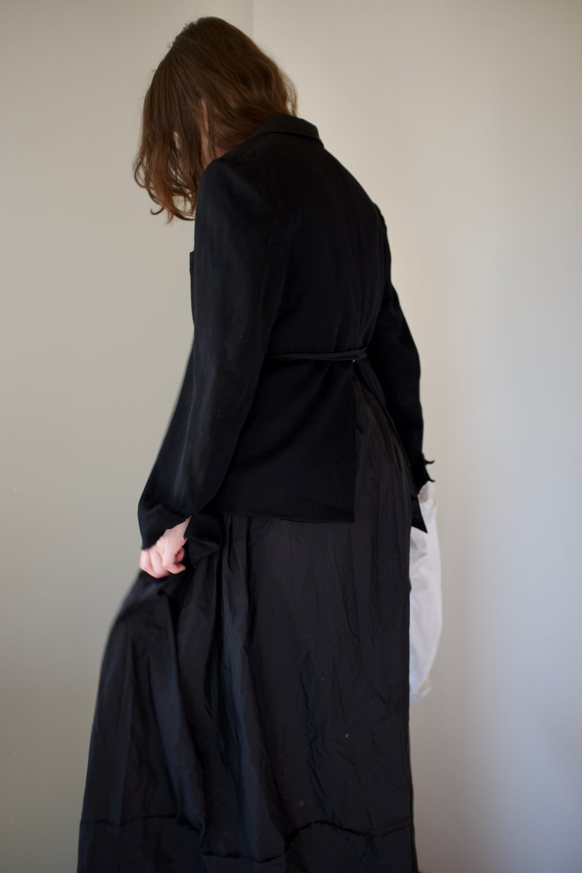 Black asymmetrical dinner jacket with waist ties