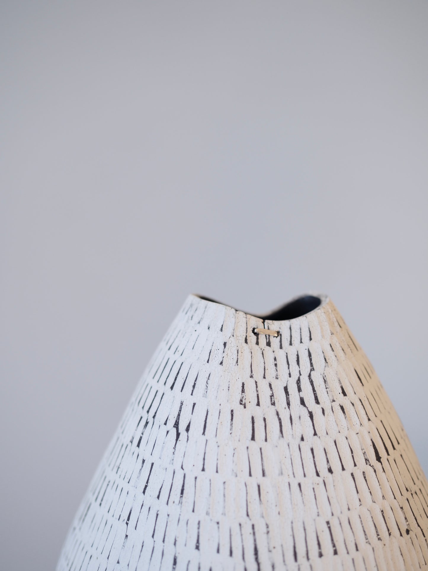 Black Carved Pod Vase / White Carved Pod Vase with Silver Staple