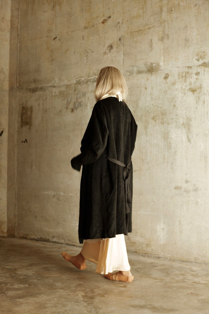 Black wool coat with silk lapel and waist tie front