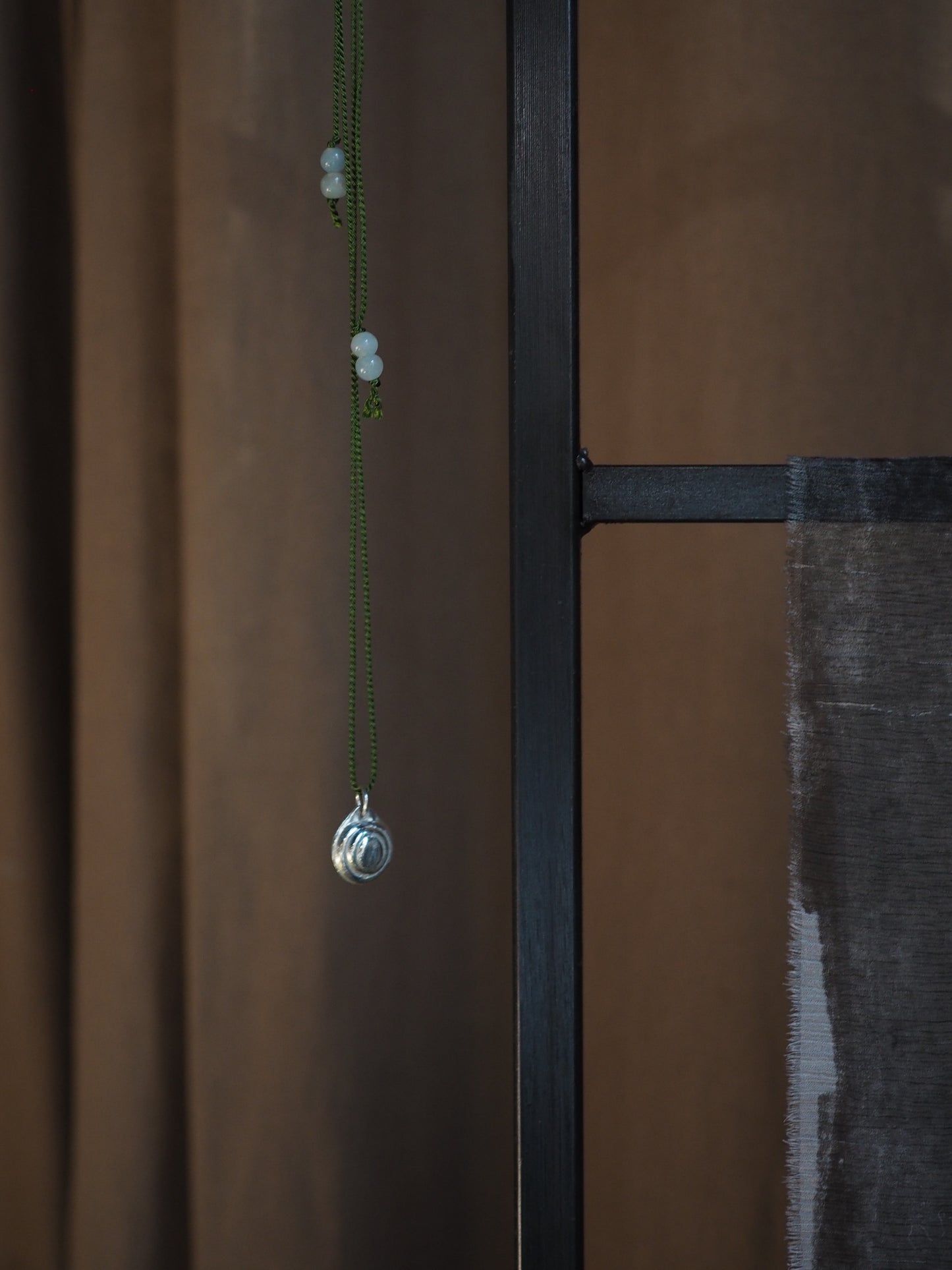 Silver Moon Shell on Green Silk Necklace