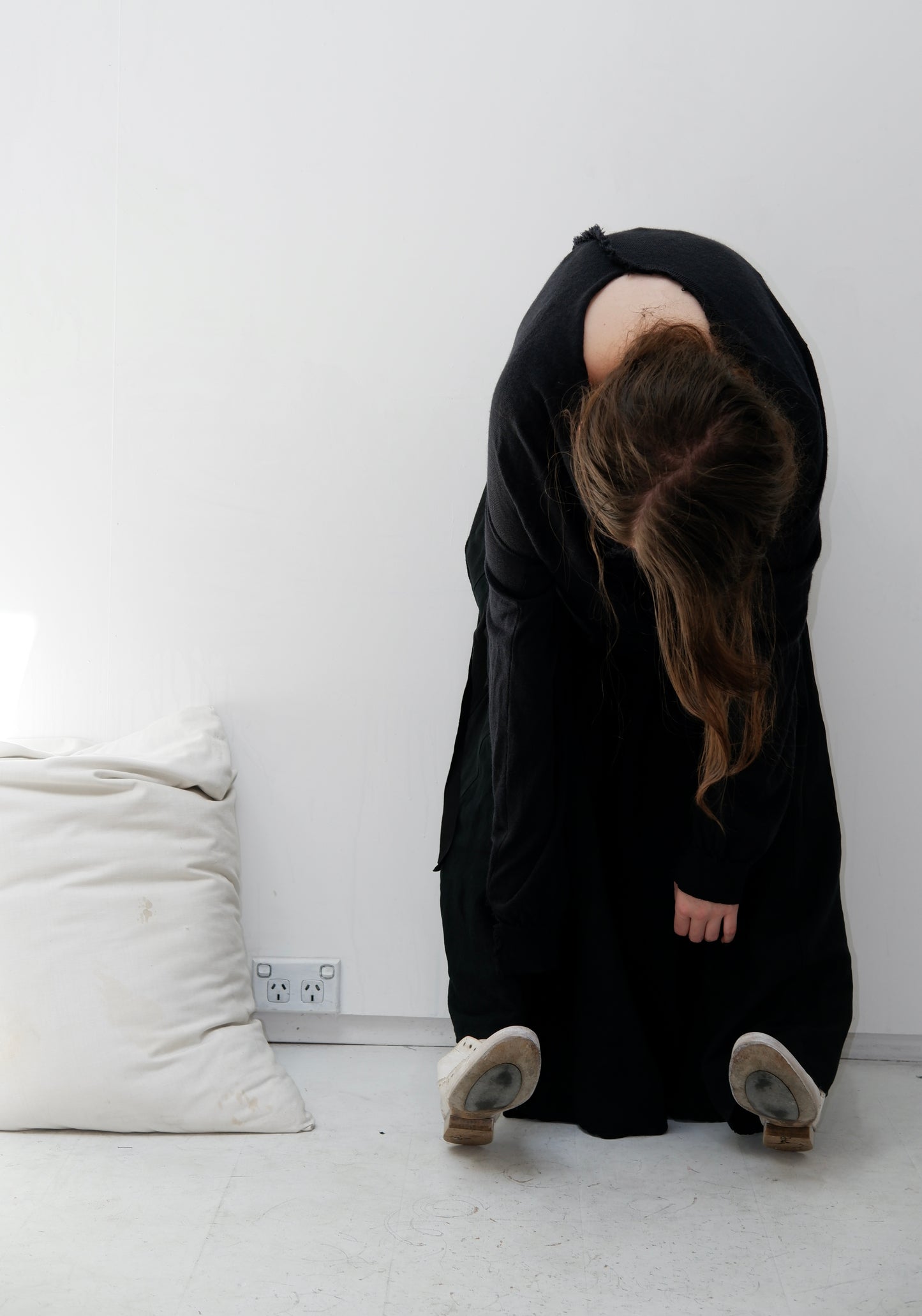 Charcoal merino jumper with blue panel at front / Black patched skirt with pleats