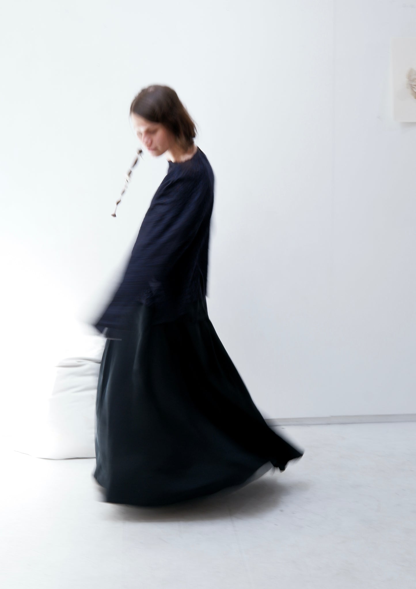 Charcoal merino jumper with blue panel at front / Black patched skirt with pleats