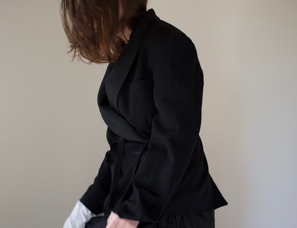 Black asymmetrical dinner jacket with waist ties