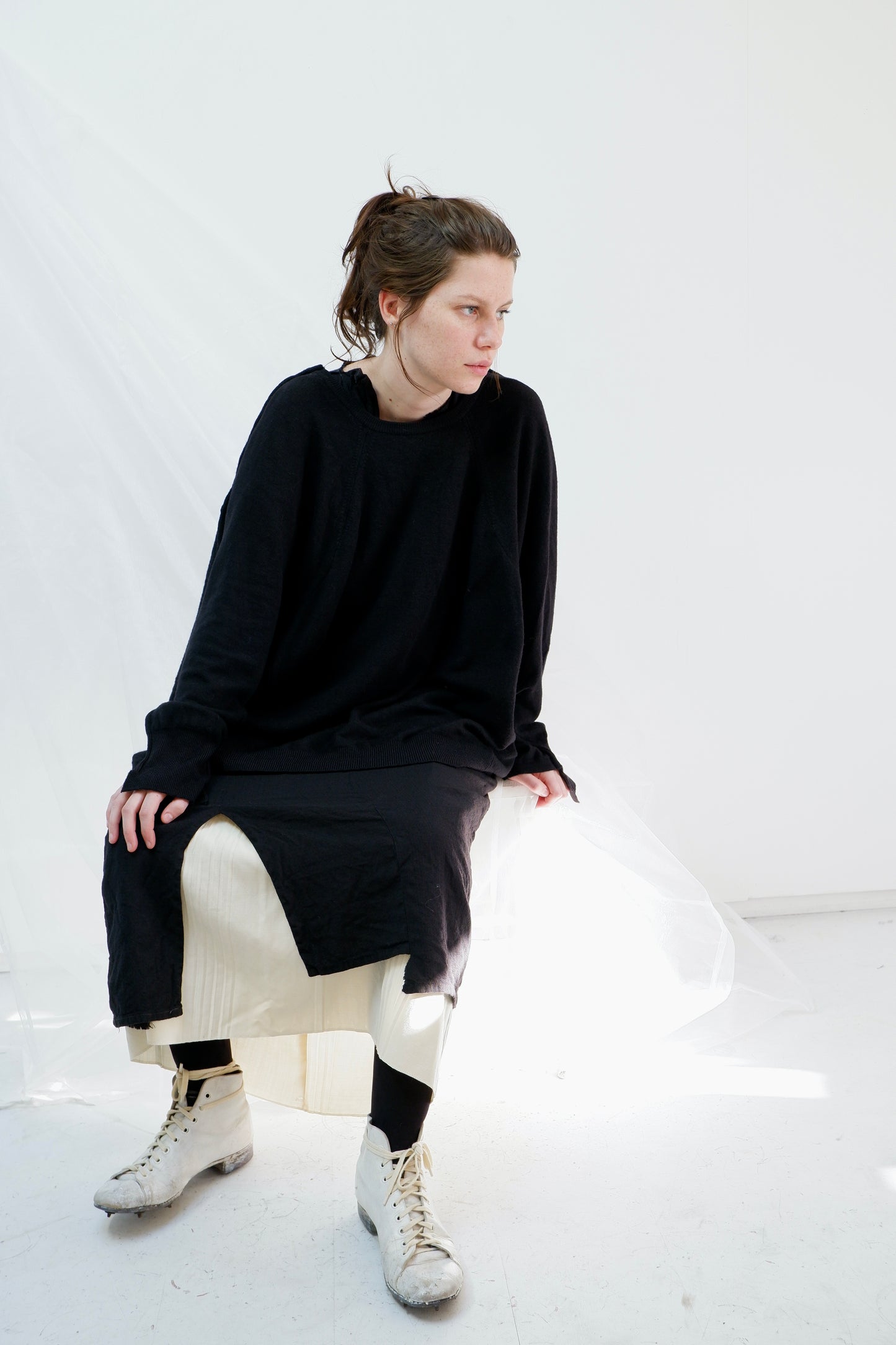 Black Merino '2 sides' jumper with hand-stitched neck