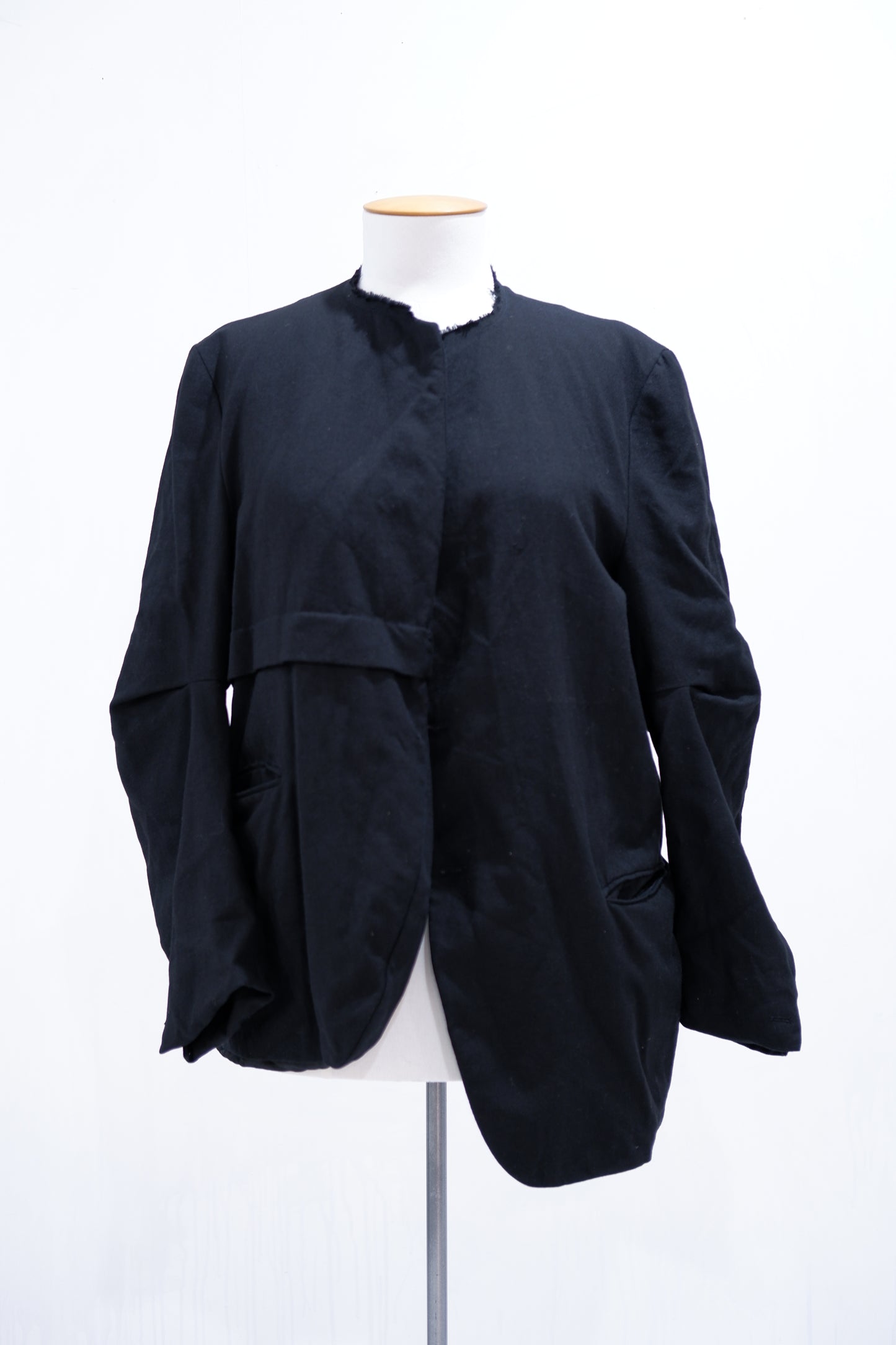 Black deconstructed jacket with waist tuck