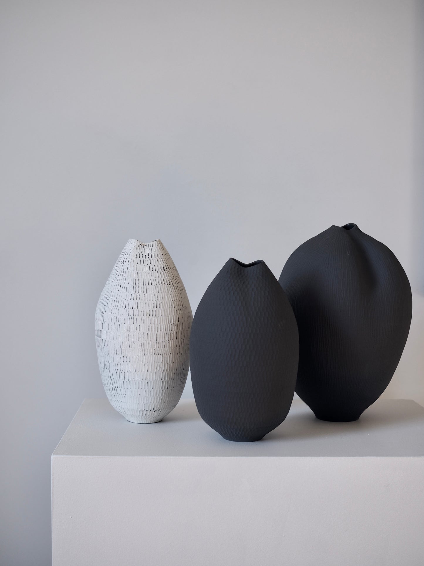 Black Carved Pod Vase / White Carved Pod Vase with Silver Staple