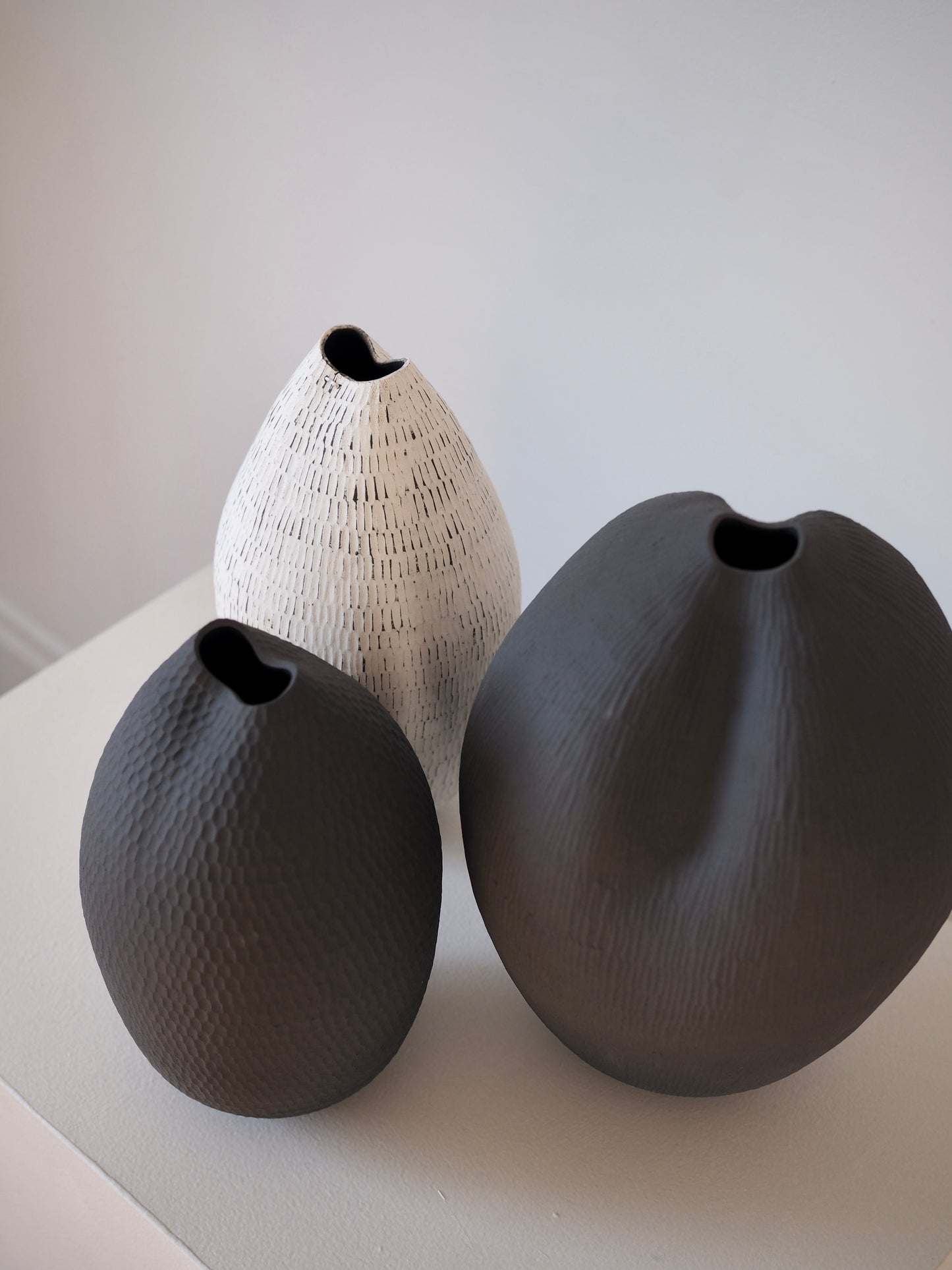 Black Carved Pod Vase / White Carved Pod Vase with Silver Staple