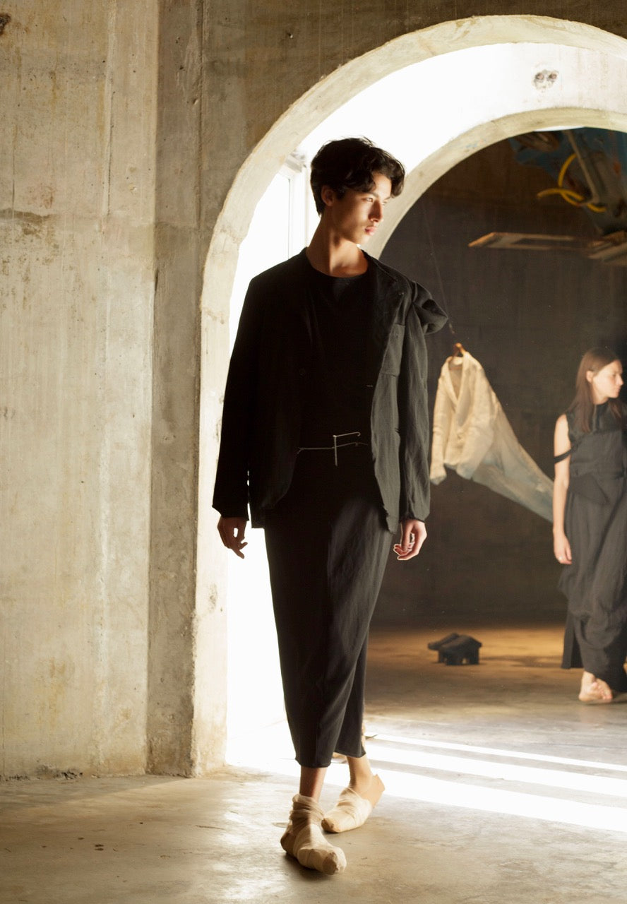 Black deconstructed jacket with sculptural shoulder / Black skirt w pockets