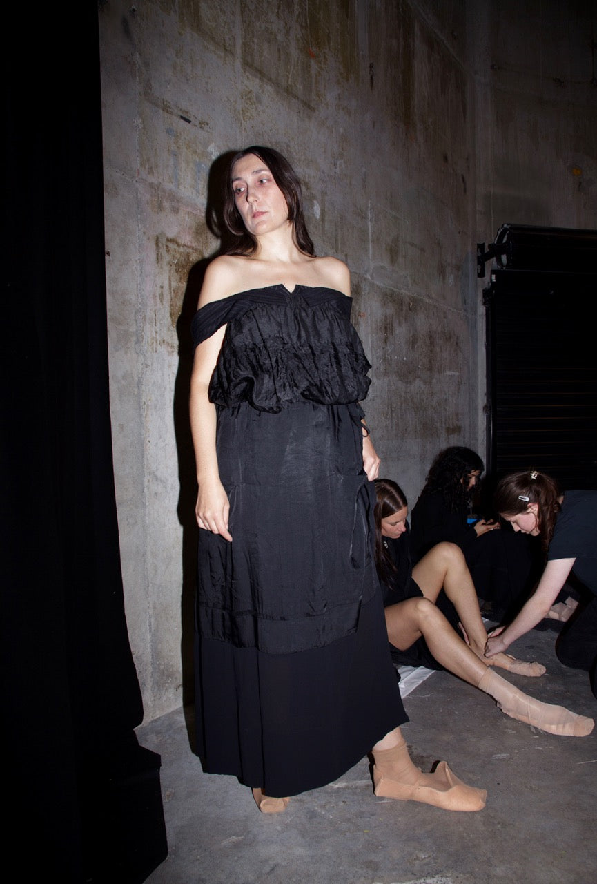 Black deconstructed jacket with sculptural shoulder / Black skirt w pockets