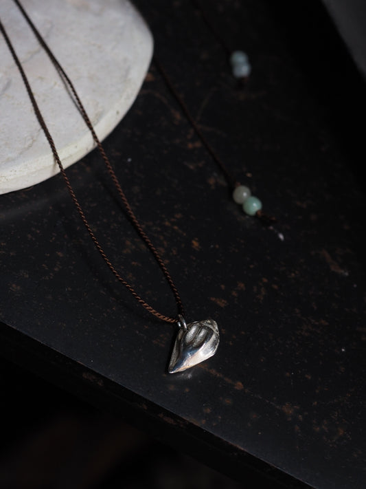 Silver Almond Shell on Brown Silk Necklace