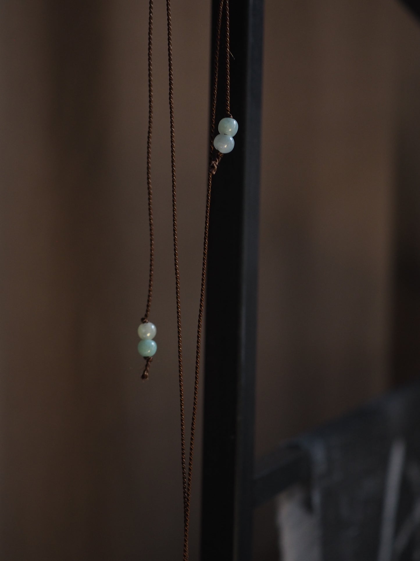 Silver Almond Shell on Brown Silk Necklace