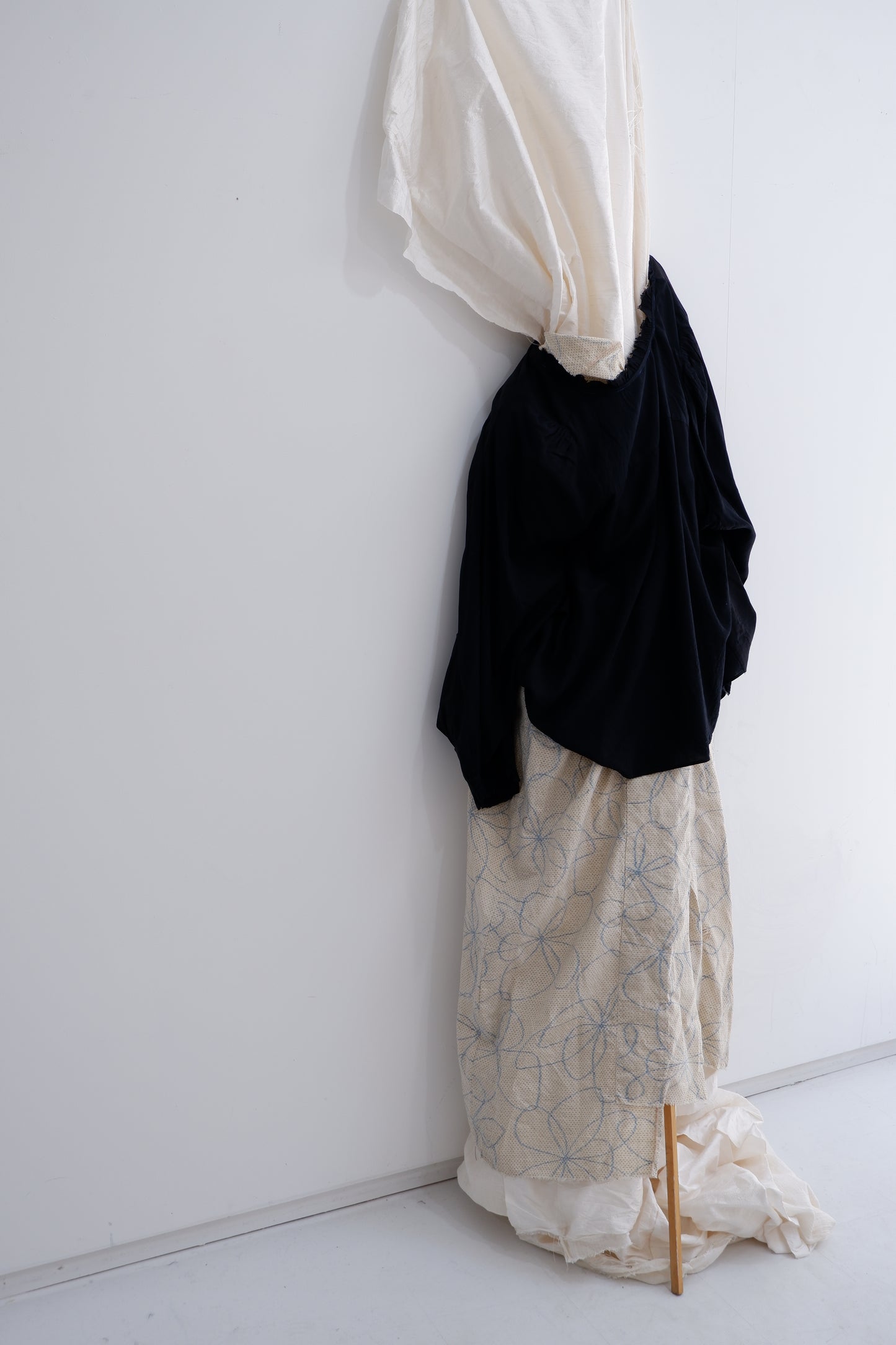 Black ‘2 sides’ long-sleeves top.  W. Hand stitching