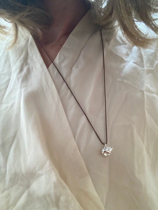 Silver Conch on Brown Silk Necklace / Silver Dumpling on Red Silk Necklace
